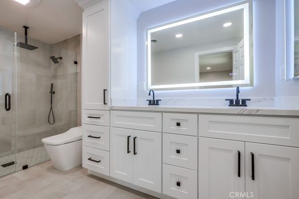 Bathroom, Dual Sink Vanities, Glass Shower, Interior, Recessed Lighting, Wood Texture Flooring