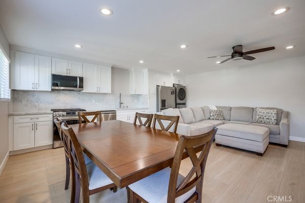 Dining room, Interior, Kitchen, Living room, Recessed Lighting, Stainless Steel Appliances, Wood Texture Flooring