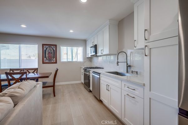 Dining room, Interior, Kitchen, Recessed Lighting, Stainless Steel Appliances, Wood Texture Flooring