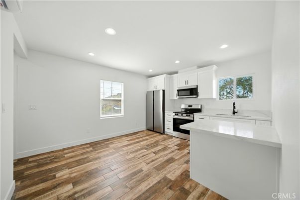 Interior, Kitchen, Recessed Lighting, Stainless Steel Appliances, Wood Texture Flooring