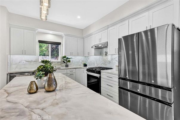 Interior, Kitchen, Marble Walls, Recessed Lighting, Stainless Steel Appliances