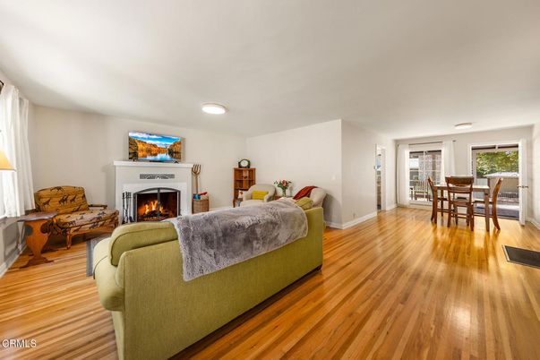 Dining room, Fireplace, Interior, Living room, Recessed Lighting, Wood Texture Flooring