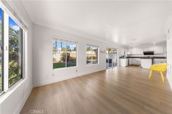 Empty room, Interior, Kitchen, Recessed Lighting, Stainless Steel Appliances, Wood Texture Flooring