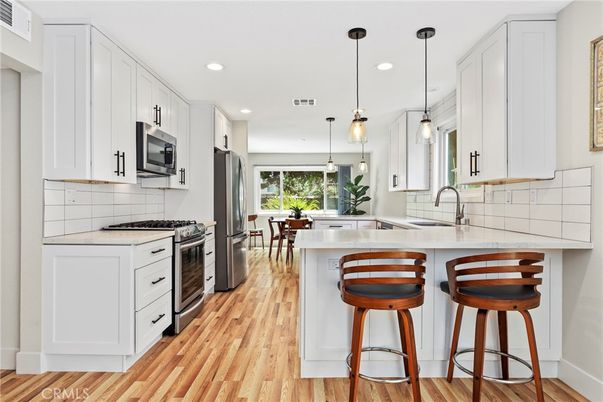Interior, Kitchen, Pendant Lights, Recessed Lighting, Stainless Steel Appliances, Wood Texture Flooring