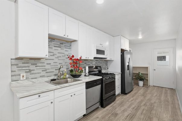 Interior, Kitchen, Recessed Lighting, Stainless Steel Appliances, Wood Texture Flooring