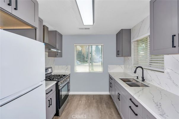 Interior, Kitchen, Marble Walls, Stainless Steel Appliances, Wood Texture Flooring