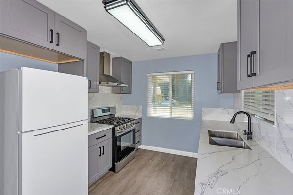 Interior, Kitchen, Marble Walls, Stainless Steel Appliances, Wood Texture Flooring