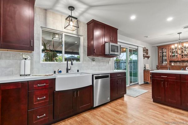 Chandelier, Interior, Kitchen, Pendant Lights, Recessed Lighting, Stainless Steel Appliances, Wood Texture Flooring