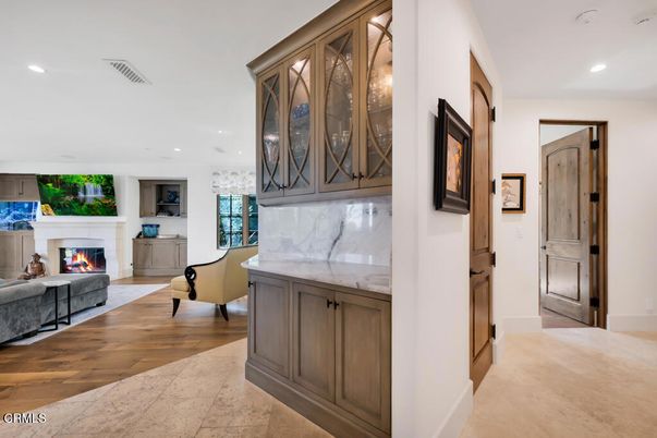 Fireplace, Interior, Marble Walls, Recessed Lighting, Wood Texture Flooring