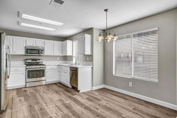Chandelier, Interior, Kitchen, Pendant Lights, Stainless Steel Appliances, Wood Texture Flooring