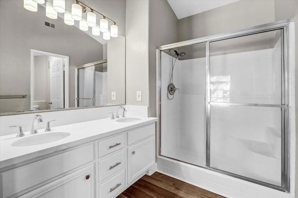 Bathroom, Dual Sink Vanities, Glass Shower, Interior, Wood Texture Flooring