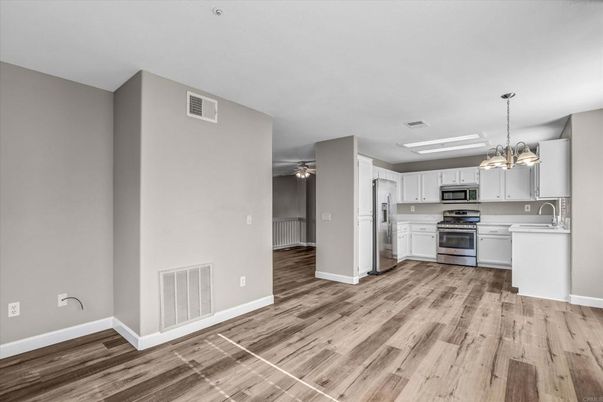 Chandelier, Empty room, Interior, Kitchen, Pendant Lights, Stainless Steel Appliances, Wood Texture Flooring