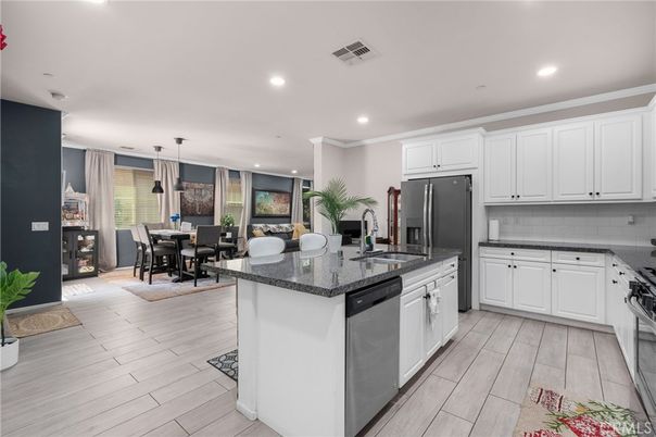 Dining room, Interior, Kitchen, Pendant Lights, Recessed Lighting, Stainless Steel Appliances, Wood Texture Flooring