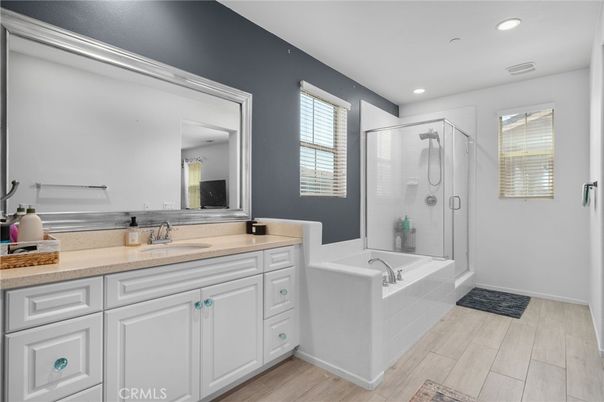 Bathroom, Dual Sink Vanities, Glass Shower, Interior, Recessed Lighting, Wood Texture Flooring