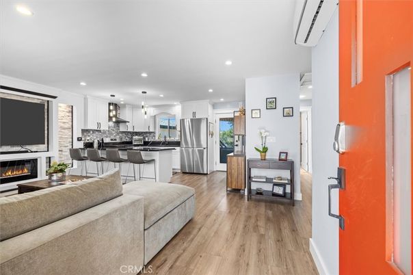 Fireplace, Interior, Kitchen, Living room, Pendant Lights, Recessed Lighting, Stainless Steel Appliances, Wood Texture Flooring