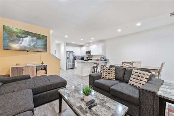 Dining room, Interior, Kitchen, Living room, Recessed Lighting, Stainless Steel Appliances, Wood Texture Flooring