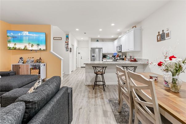 Dining room, Interior, Kitchen, Living room, Recessed Lighting, Stainless Steel Appliances, Wood Texture Flooring