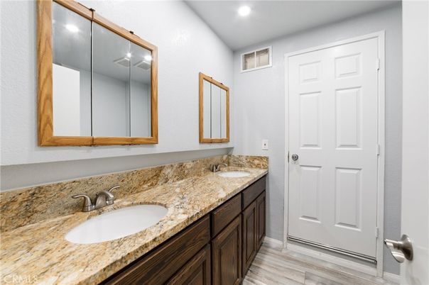 Bathroom, Dual Sink Vanities, Interior, Recessed Lighting, Wood Texture Flooring