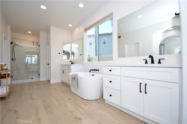 Bathroom, Dual Sink Vanities, Free Standing Baths, Glass Shower, Interior, Recessed Lighting, Wood Texture Flooring