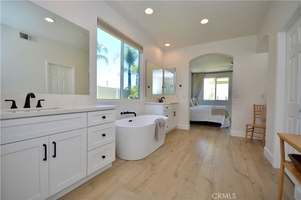 Bathroom, Dual Sink Vanities, Free Standing Baths, Interior, Recessed Lighting, Wood Texture Flooring