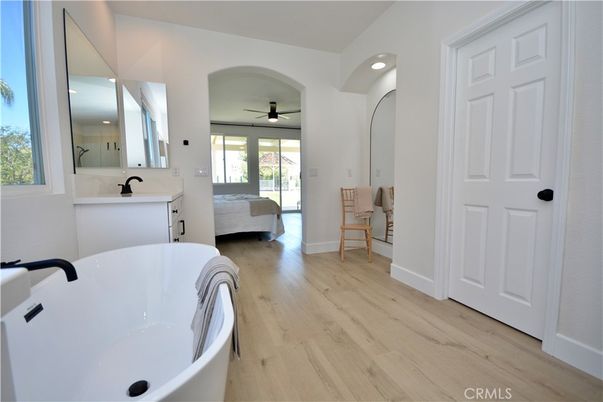Bathroom, Dual Sink Vanities, Free Standing Baths, Interior, Recessed Lighting, Wood Texture Flooring