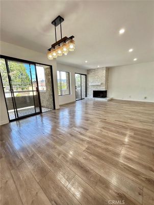 Chandelier, Empty room, Fireplace, Interior, Recessed Lighting, Wood Texture Flooring