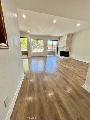 Empty room, Fireplace, Interior, Recessed Lighting, Stone Walls, Wood Texture Flooring