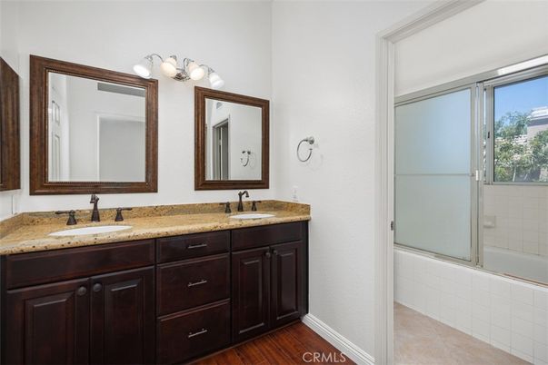 Bathroom, Dual Sink Vanities, Glass Shower, Interior, Wood Texture Flooring