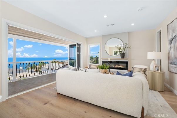 Fireplace, Interior, Living room, Recessed Lighting, Water, Wood Texture Flooring