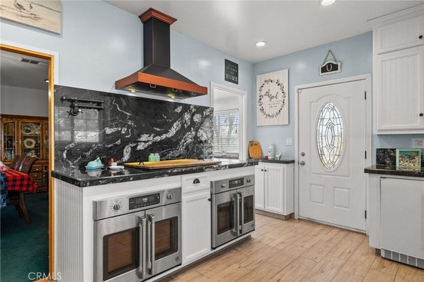 Interior, Kitchen, Marble Walls, Recessed Lighting, Stainless Steel Appliances, Wood Texture Flooring