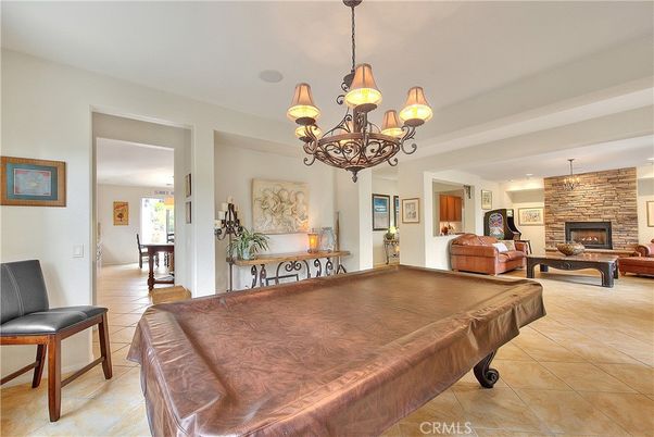 Billiard Table, Chandelier, Fireplace, Game Room, Interior, Living room, Stone Walls