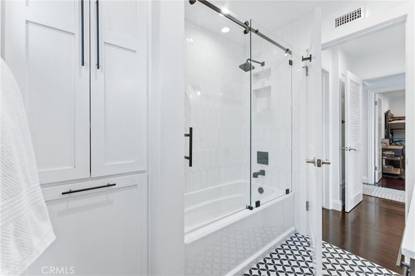 Bathroom, Glass Shower, Interior, Marble Walls, Recessed Lighting, Wood Texture Flooring