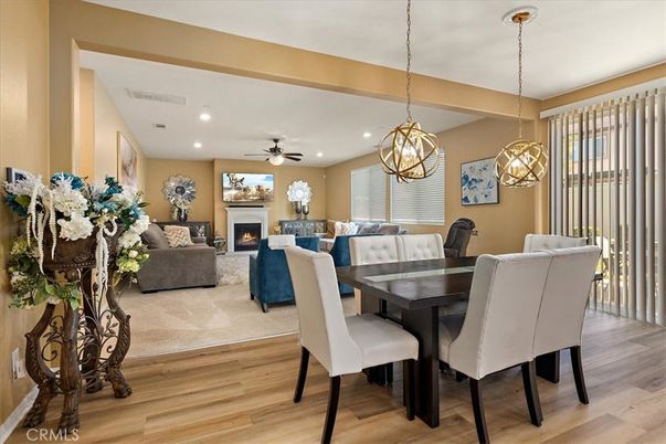 Dining room, Fireplace, Interior, Living room, Pendant Lights, Recessed Lighting, Wood Texture Flooring