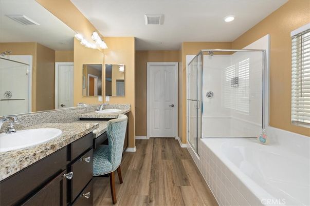 Bathroom, Dual Sink Vanities, Glass Shower, Interior, Recessed Lighting, Wood Texture Flooring