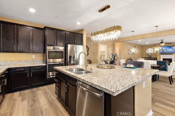 Chandelier, Dining room, Interior, Kitchen, Pendant Lights, Recessed Lighting, Stainless Steel Appliances, Wood Texture Flooring