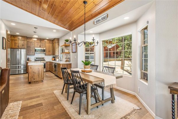 Chandelier, Dining room, Interior, Kitchen, Pendant Lights, Recessed Lighting, Stainless Steel Appliances, Wooden Ceilings, Wood Texture Flooring