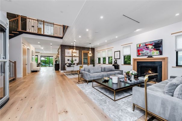 Dining room, Fireplace, Interior, Living room, Pendant Lights, Recessed Lighting, Wood Texture Flooring