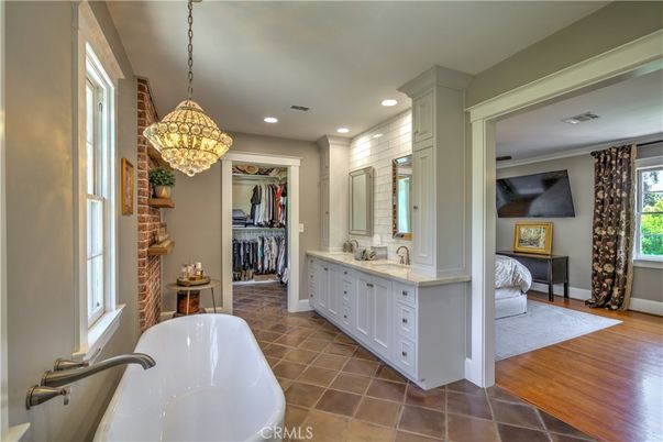 Bathroom, Dual Sink Vanities, Free Standing Baths, Interior, Pendant Lights, Recessed Lighting, Walk-in Closets, Wood Texture Flooring