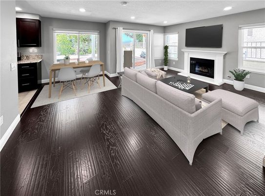 Dining room, Fireplace, Interior, Living room, Recessed Lighting, Wood Texture Flooring