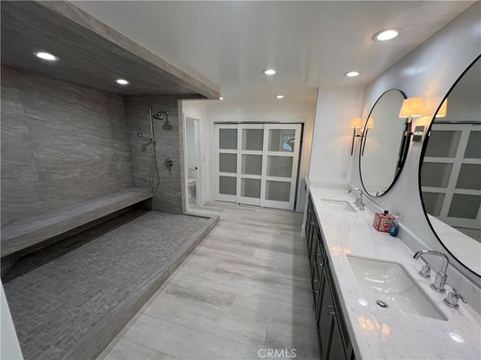 Bathroom, Dual Sink Vanities, Glass Shower, Interior, Marble Walls, Recessed Lighting