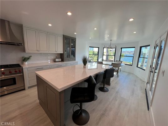 Dining room, Interior, Kitchen, Pendant Lights, Recessed Lighting, Stainless Steel Appliances, Water, Wood Texture Flooring