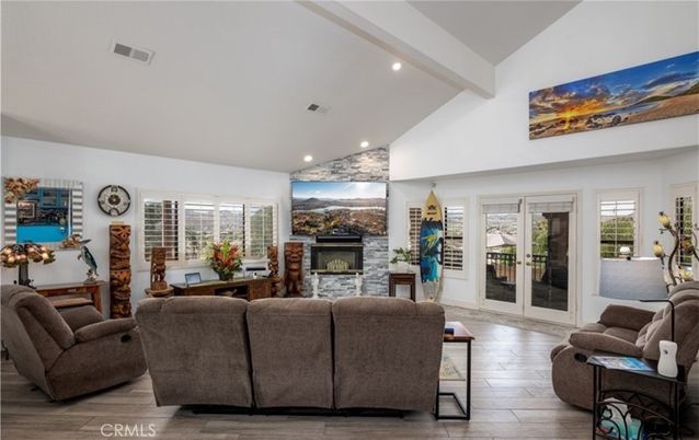 Fireplace, Interior, Living room, Recessed Lighting, Stone Walls, Wood Texture Flooring