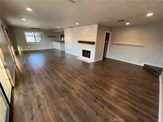 Empty room, Fireplace, Interior, Pendant Lights, Recessed Lighting, Wood Texture Flooring