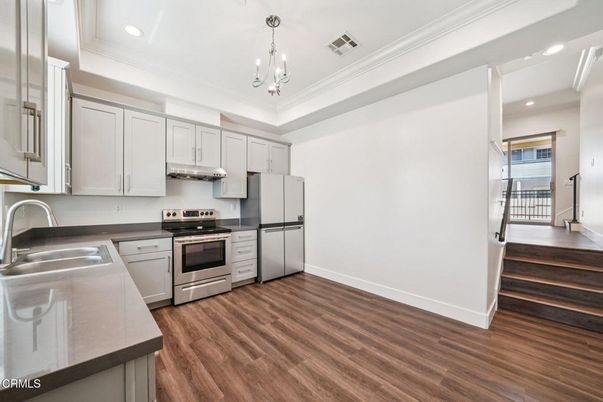 Chandelier, Interior, Kitchen, Recessed Lighting, Stainless Steel Appliances, Wood Texture Flooring