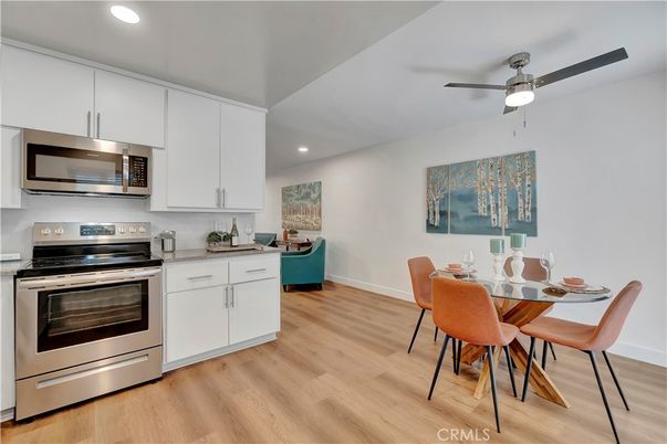 Dining room, Interior, Kitchen, Recessed Lighting, Stainless Steel Appliances, Wood Texture Flooring