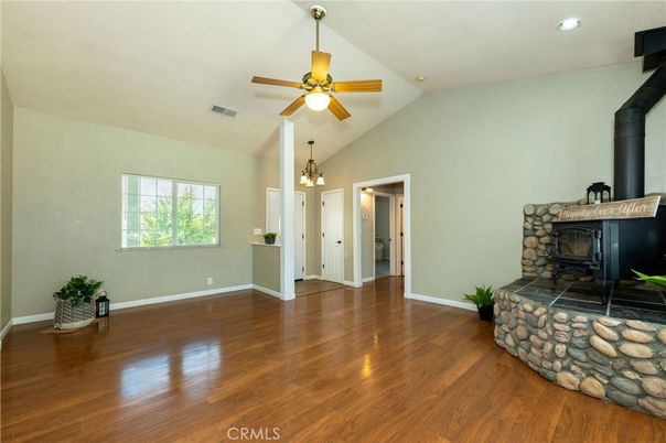 Chandelier, Empty room, Fireplace, Interior, Recessed Lighting, Wood Texture Flooring