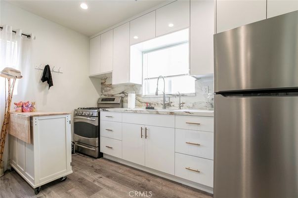 Interior, Kitchen, Recessed Lighting, Stainless Steel Appliances, Wood Texture Flooring
