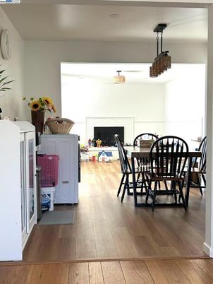 Dining room, Fireplace, Interior, Pendant Lights, Wood Texture Flooring