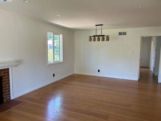 Empty room, Fireplace, Interior, Pendant Lights, Recessed Lighting, Wood Texture Flooring
