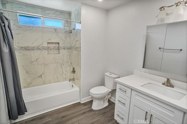 Bathroom, Glass Shower, Interior, Marble Walls, Recessed Lighting, Wood Texture Flooring